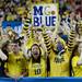 Michigan fans cheer at the start of the national championship game at the Georgia in Atlanta on Monday, April 8, 2013. Melanie Maxwell I AnnArbor.com